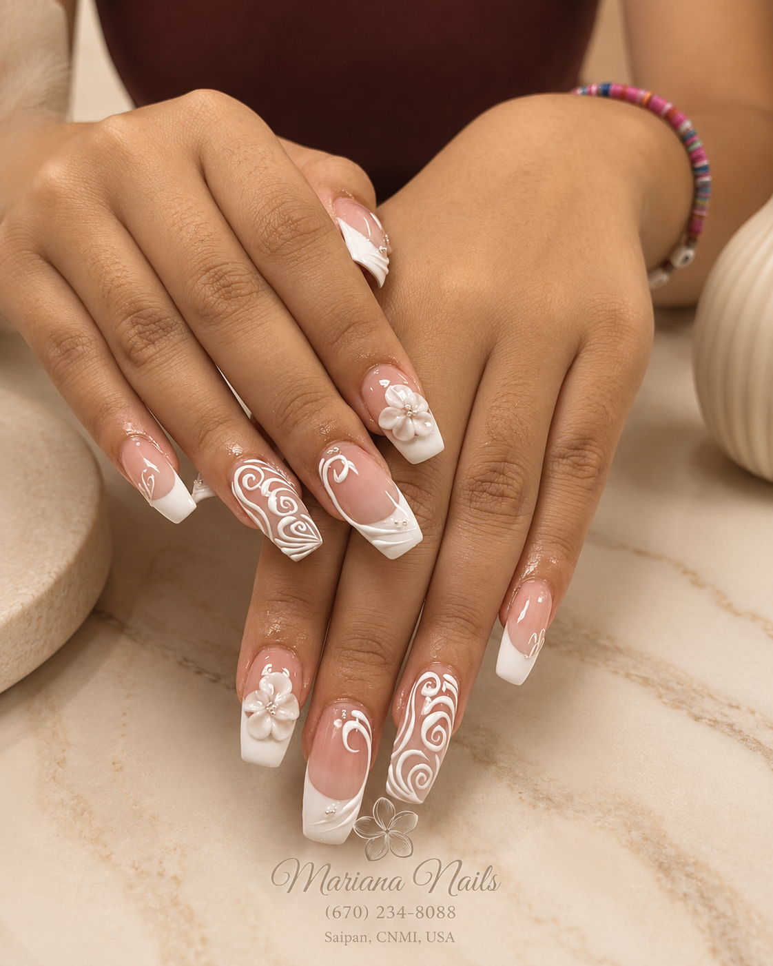 Glossy nude pink square acrylic nails with white French tips, swirl nail art and 3D floral accents by Mariana Nails in Saipan