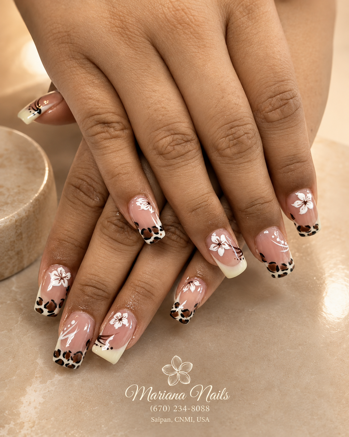 Glossy nude pink square acrylic nails with leopard-print French tips and white floral nail art by Mariana Nails in Saipan