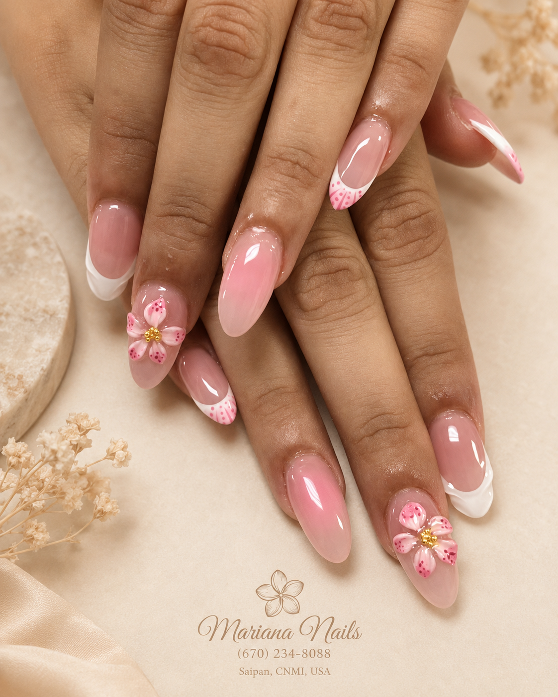 Glossy light pink almond nails with white French tips, 3D pink floral accents and gold details by Mariana Nails in Saipan